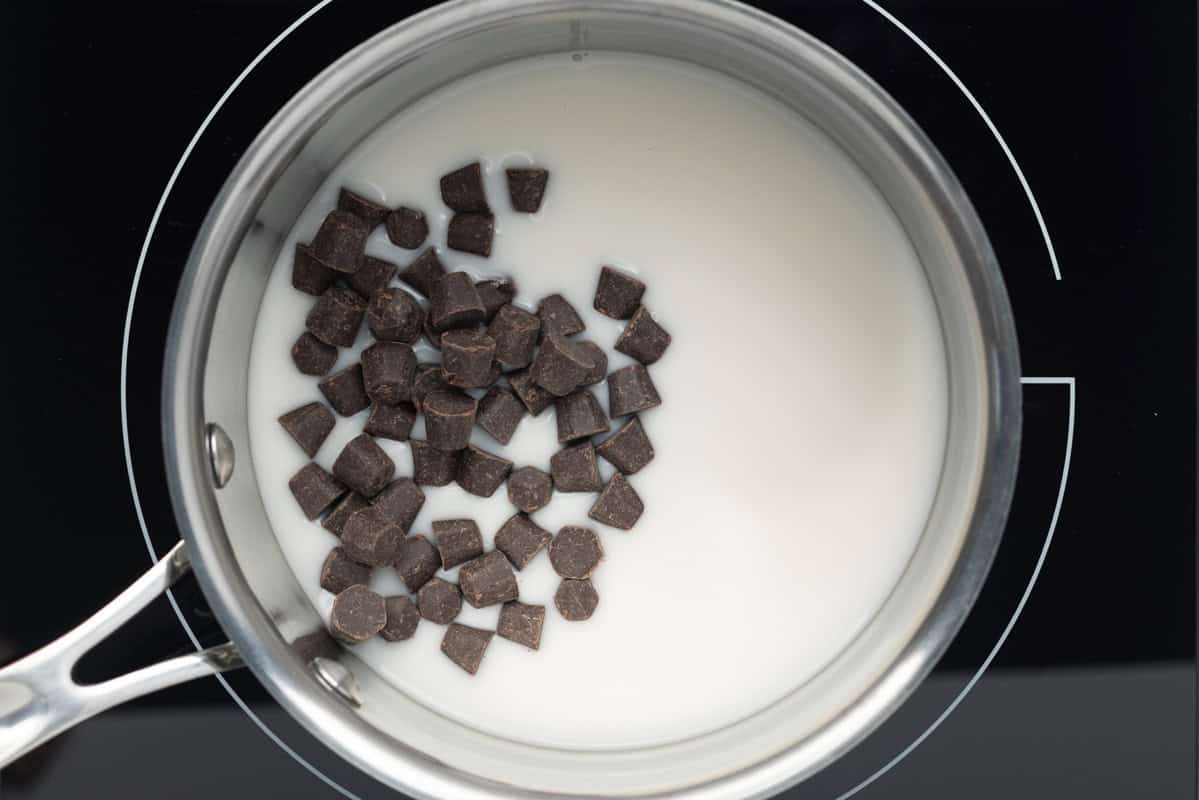 Almond milk and chocolate chips in a small saucepan.