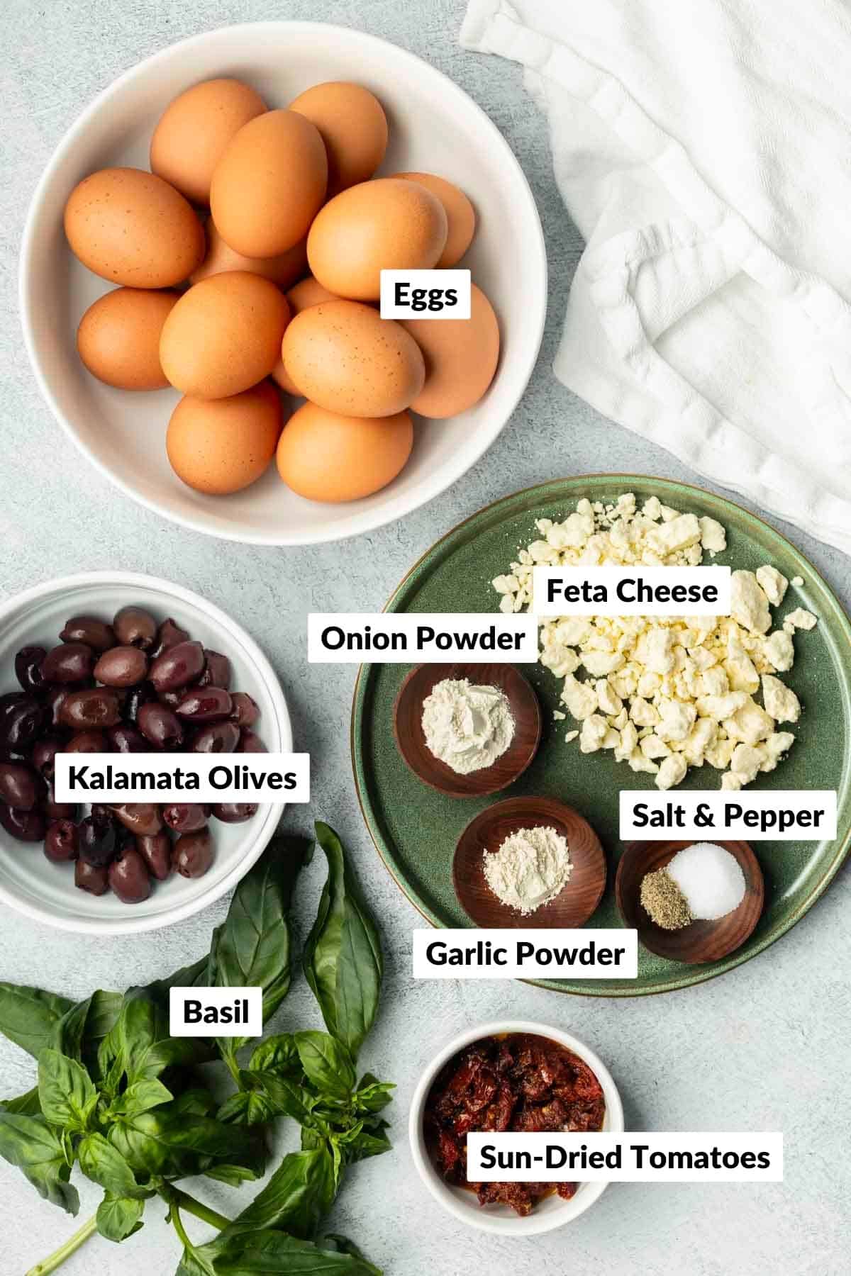 Recipe ingredients in separate containers for sheet pan eggs.