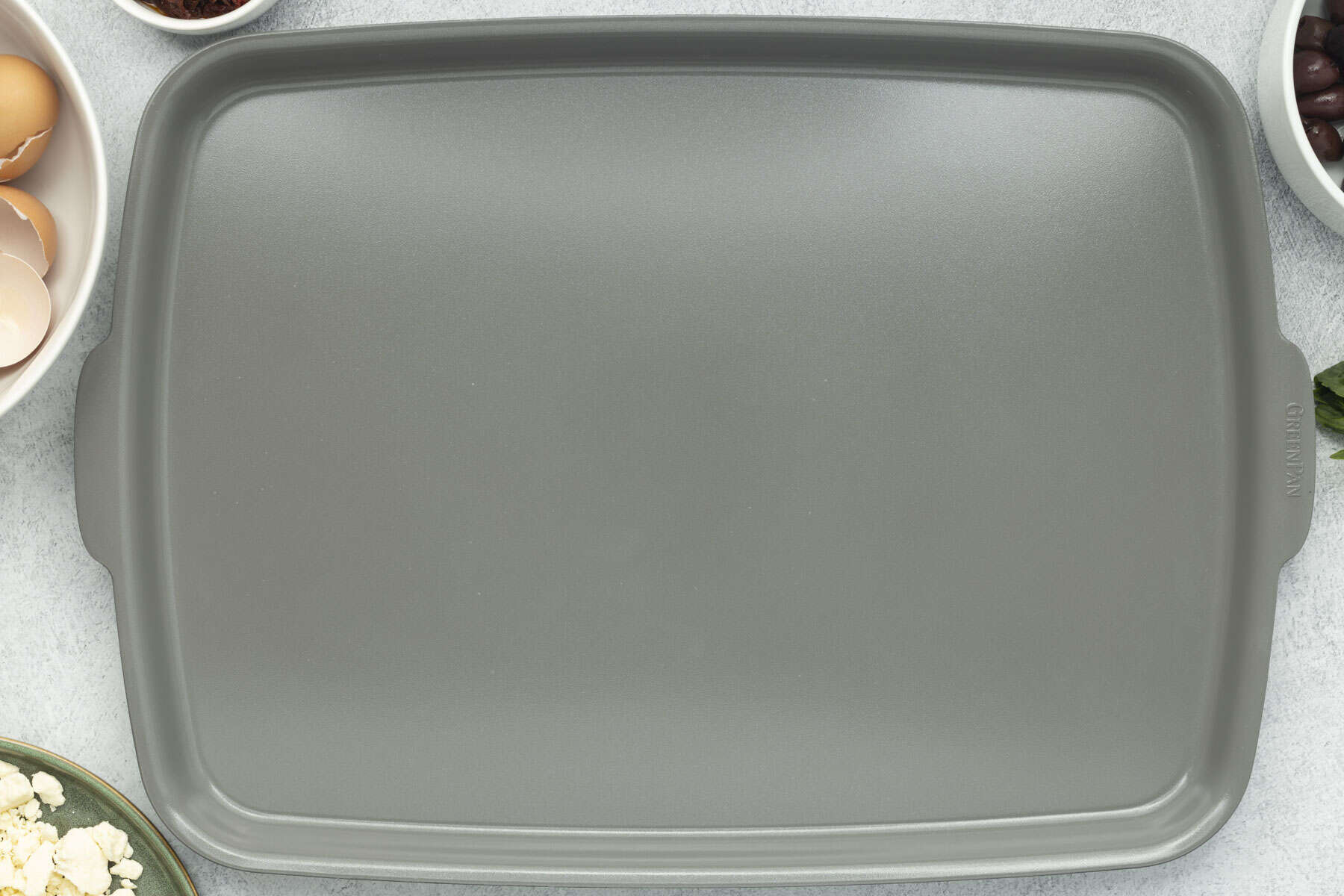 Ceramic non-stick sheet pan placed on the counter for use.